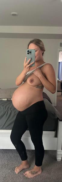 Peek a boo with my 7 months pregnant belly